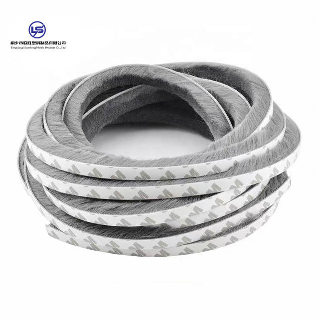 Self-adhesive wool pile weather strip for building door